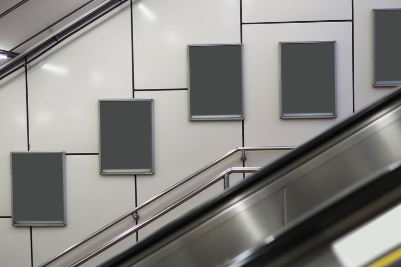 empty billboard frame (advertising) at subway (escalator)